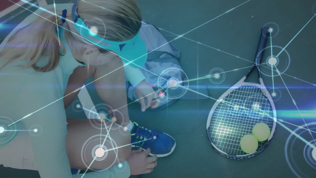 female tennis player kneeling tying shoe on court showing network overlay for sports technology