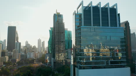 sun shining through contemporary buildings in downtown panama city in panama