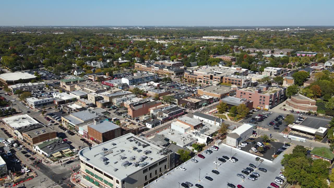 Naperville, IL, a Chicago suburb, on a sunny fall day, featuring buildings, streets. Crane Down Left Day NW