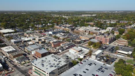 naperville, il, a chicago suburb, on a sunny fall day, featuring buildings, streets. crane down left day nw