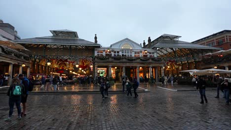 rainy evening at covent garden christmas market in london