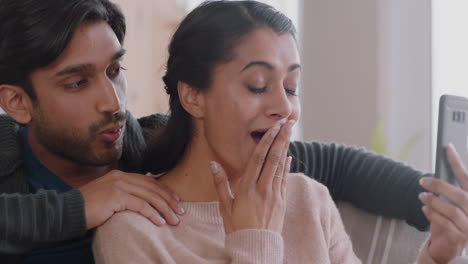 happy-indian-couple-having-video-chat-using-smartphone-chatting-to-friend-looking-surprised-enjoying-online-communication-on-mobile-phone