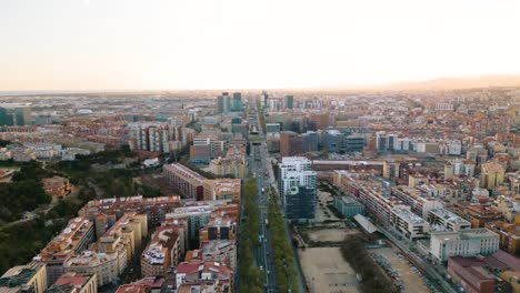 Aerial-Pullback-Reveals-Barcelona-Cityscape-at-Sunset-in-Popular-Spanish-City