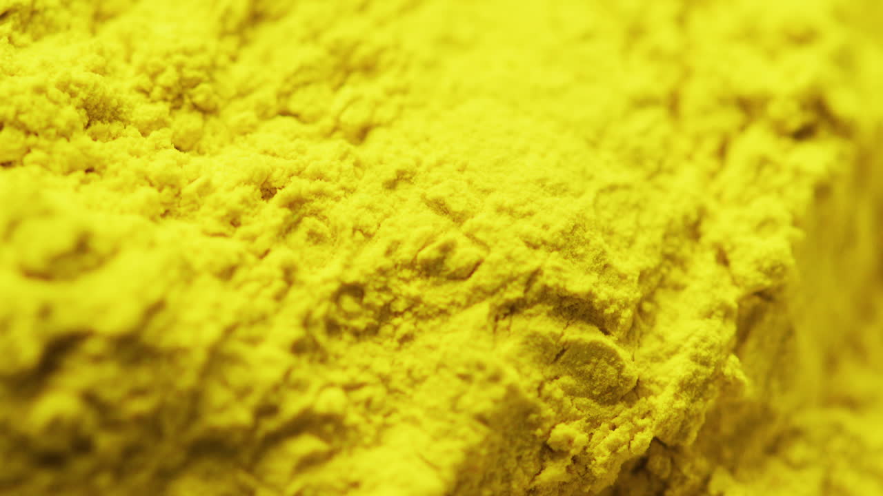Video of close up of yellow powder with copy space