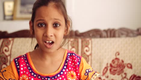 portrait of an indian child at home during coronavirus lockdown