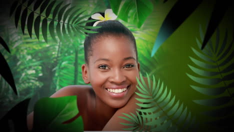 animation of happy african american woman smiling in jungle, over leaves
