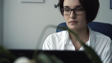 woman working on laptop in office