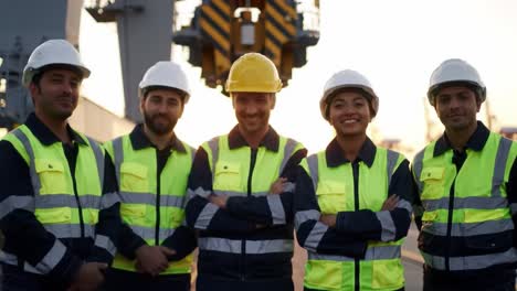 diverse team of port workers in safety gear