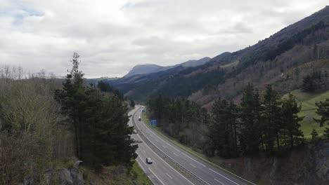 Cars-and-trucks-driving-motorway-in-Spain,-wide-angle-stable-view