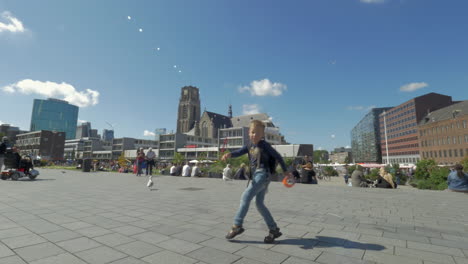 child having fun and dancing on city street rotterdam