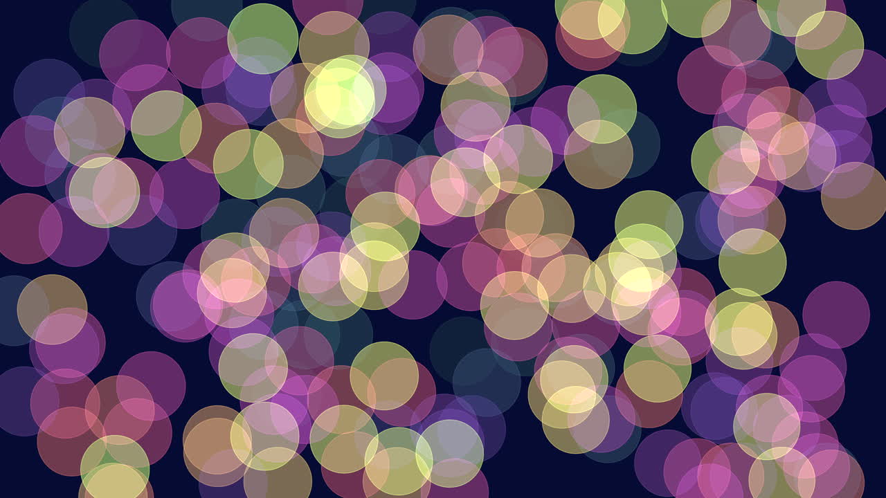 Vibrant colored circles arranged in a circular pattern on a dark background create a sense of dynamic movement and energy in this glowing and captivating image