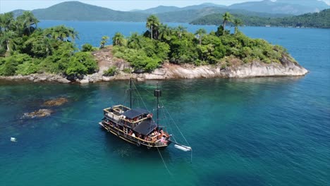 panning around a pirate ship and ocean out in a brazilian ocean