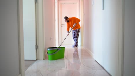 a young male cleaner cleaning rooms with a vilada