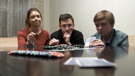 friends playing poker at home