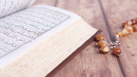 open quran and prayer beads