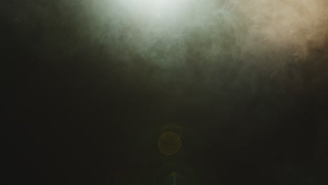 abstract textured smoke in slow motion. cloud of floating fog in light spot background. mysterious haze