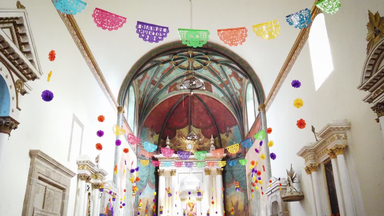 Downward shot of the interior of the Parish of the Nativity of Mary in Tepoztlán, decorated with motifs from the Day of the Dead celebration in Mexico
