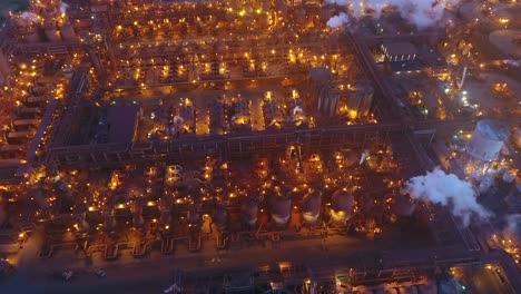 Drone-top-down-of-metal-factory-at-dusk