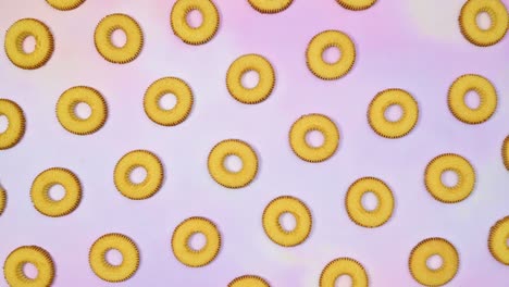 round cookies biscuit pattern blinking cookies on light purple theme. stop motion flat lay