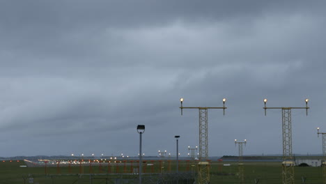 Plane-coming-into-land-at-Sydney-Airport-Australia-in-gray-stormy-weather-shot-in-4k-high-resolution