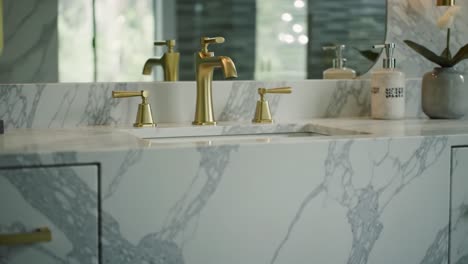 elegant bathroom design: a journey from a dimly lit doorway to a bright and stylish vanity featuring luxurious fixtures and marble details