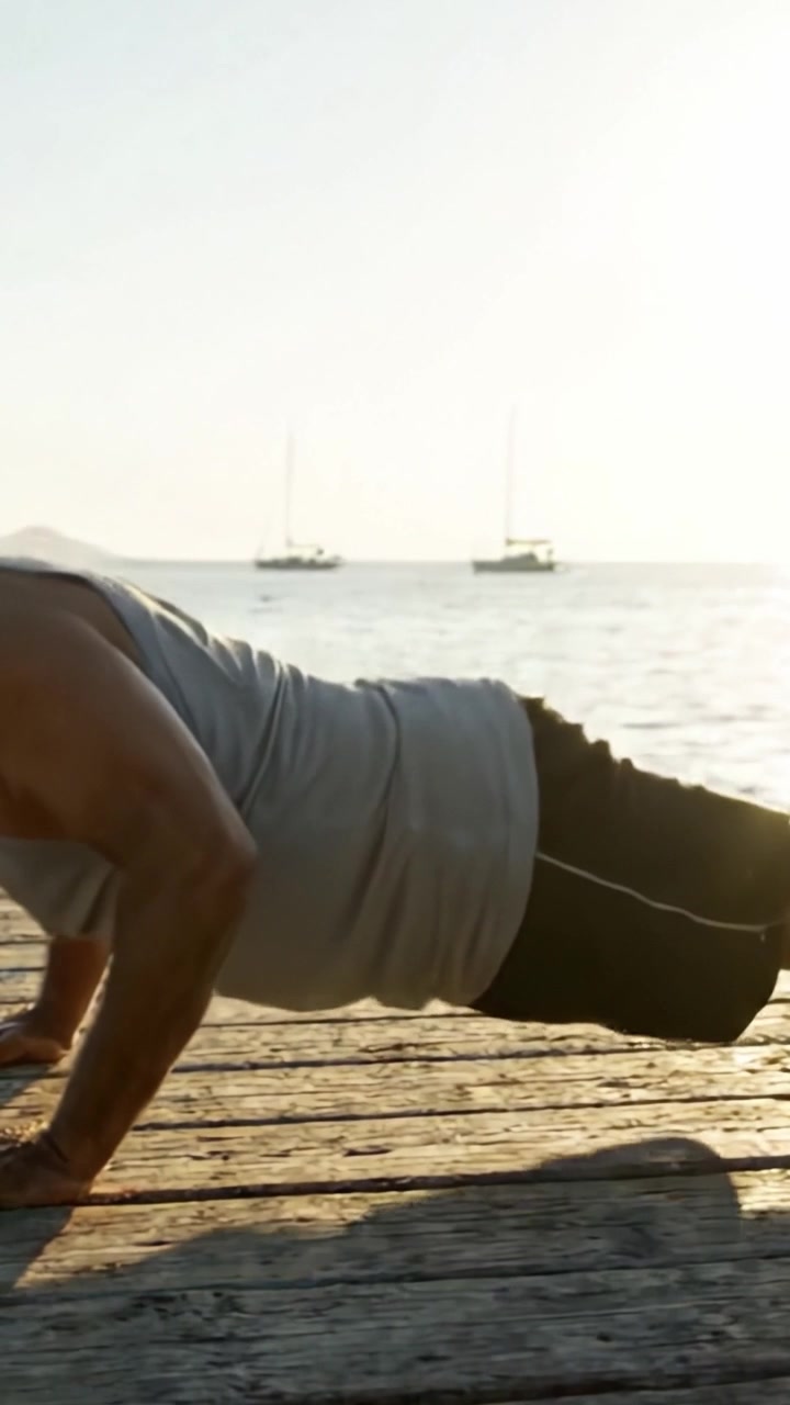 A Dedicated Individual Performing Push-Ups on a Sunlit Dock Overlooking the Water, Showcasing Strength, Discipline, and a Commitment to Fitness