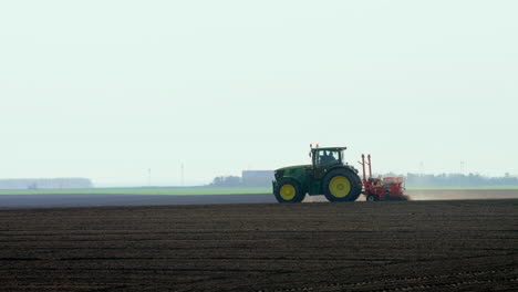 tractor planting crops in a field