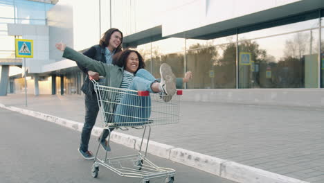 Couple having fun with a shopping cart