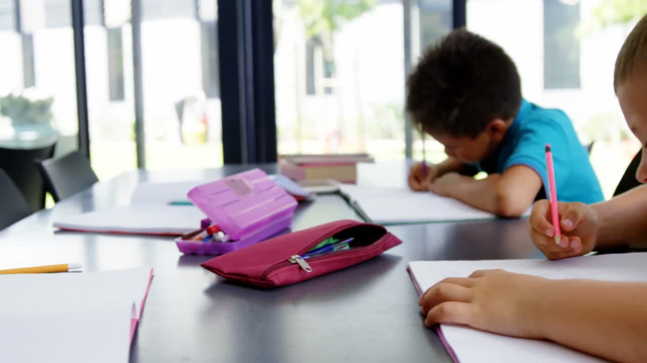 School kids doing homework in classroom