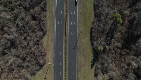 An-aerial-view-over-a-highway-on-Long-Island,-NY-on-a-sunny-day