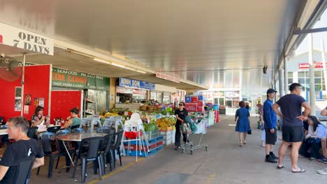 shoppers explore vibrant market stalls and produce