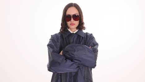portrait of a woman in an fbi jacket and sunglasses