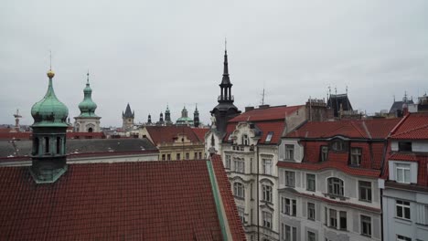 Roofs-and-towers-of-Prague,-interesting-view-from-rooftop,-capital-city-of-Czech-Republic