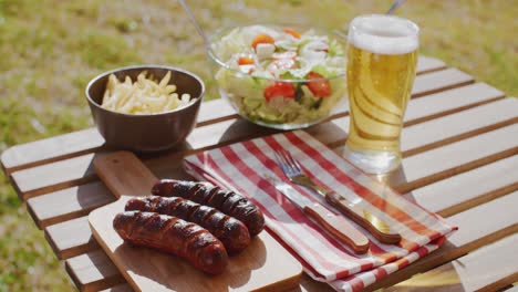 grilled sausages and salads for a summer picnic