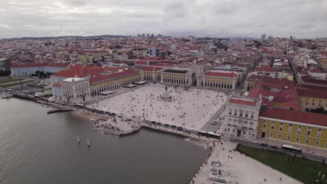 circling aerial approach view of praca do comercio in lisbon, portugal