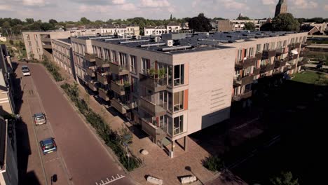 aerial showing dutch residential complex and infrastructure of noorderhaven neighbourhood in zutphen, the netherlands, seen from above revealing rooftops full of solar panels