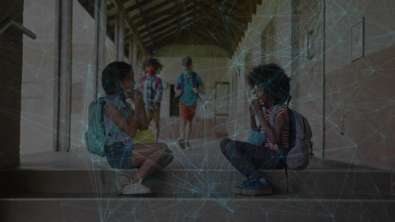 Two pupils eating snacks on school steps, network overlay tracking coming pupils passing to class