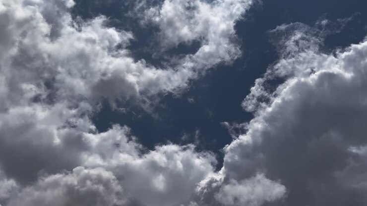 Timelapse of blue Sky with Fast moving white fluffy cloud