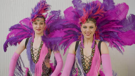 Two-Female-Dancers-In-Pink-And-Purple-Gowns-Doing-Cabaret-Dance-1