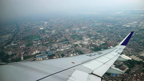 view-from-commercial-airplane-while-take-off