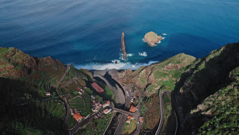 coastal cliffside village with volcanic formations
