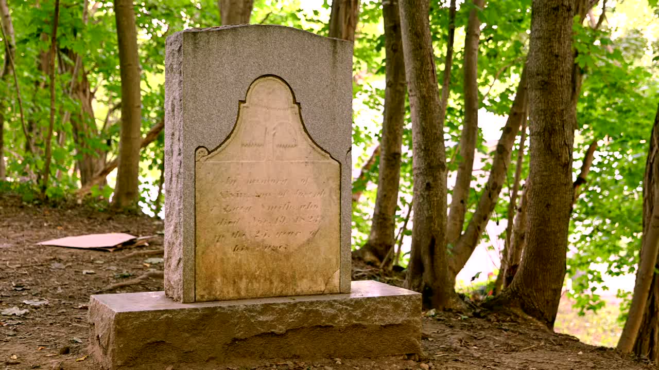 pan over Gravesite and headstone  Brother of the Mormon prophet Joseph Smith who is buried in Palmyra New York. General John Swift Cemetery.  Restored  church of Jesus Christ of Latter-day Saints