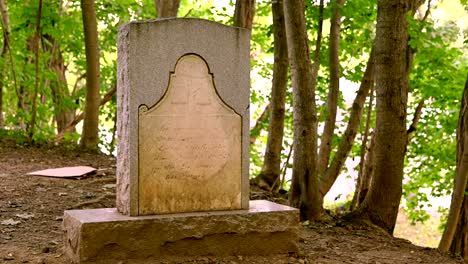 pan over gravesite and headstone  brother of the mormon prophet joseph smith who is buried in palmyra new york. general john swift cemetery.  restored  church of jesus christ of latter-day saints