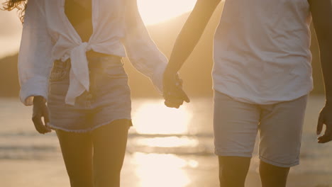 couple holding hands outdoors