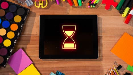 Animation-of-data-processing-with-hourglass-icon-on-tablet-screen