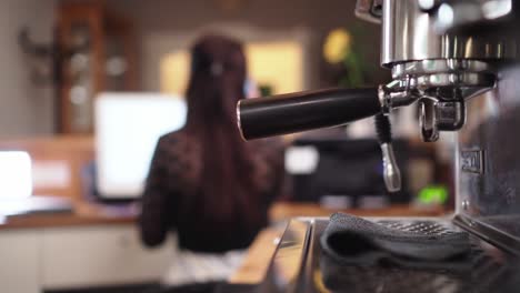 lever coffee maker with girl sitting background in reception, selective focus