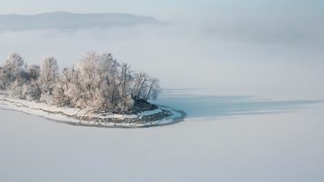 Picturesque-View-Of-Bird-Island-On-A-Misty-Winter-Afternoon---aerial-shot