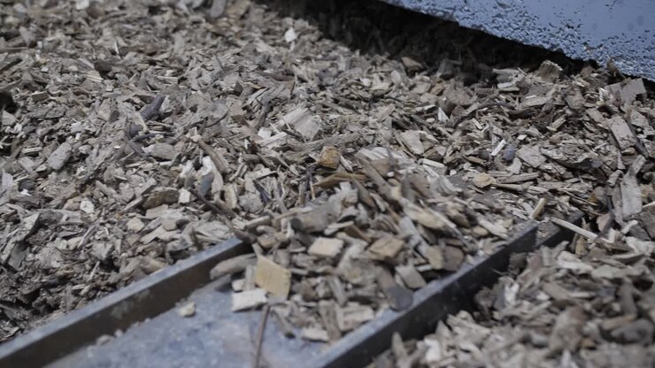 wooden chips closeup pan, bio mass heating sustainable energy, automated storage
