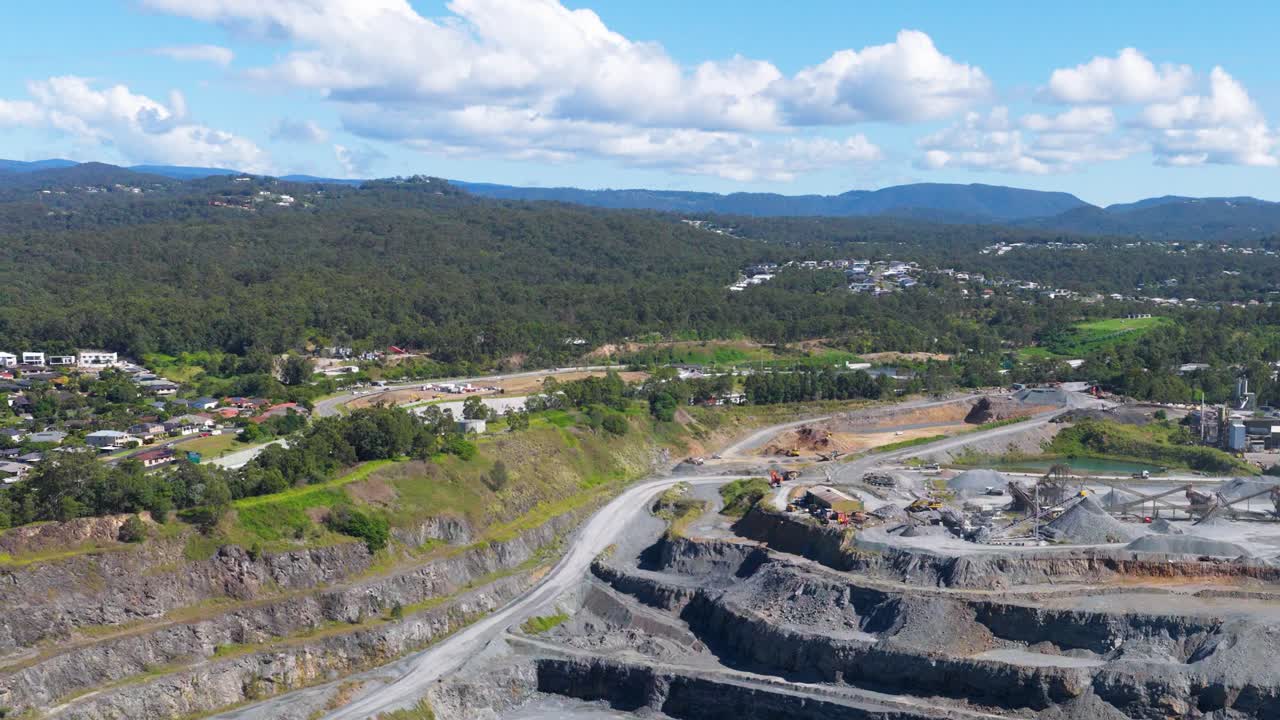 Aerial footage of a quarry in Gold Coast, Australia, showcasing expansive landscapes and clear skies with dynamic camera movement