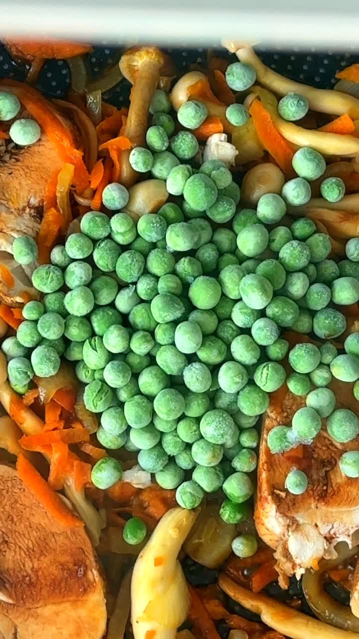 Preparing a Chicken Stir-fry with Frozen Peas and Vegetables